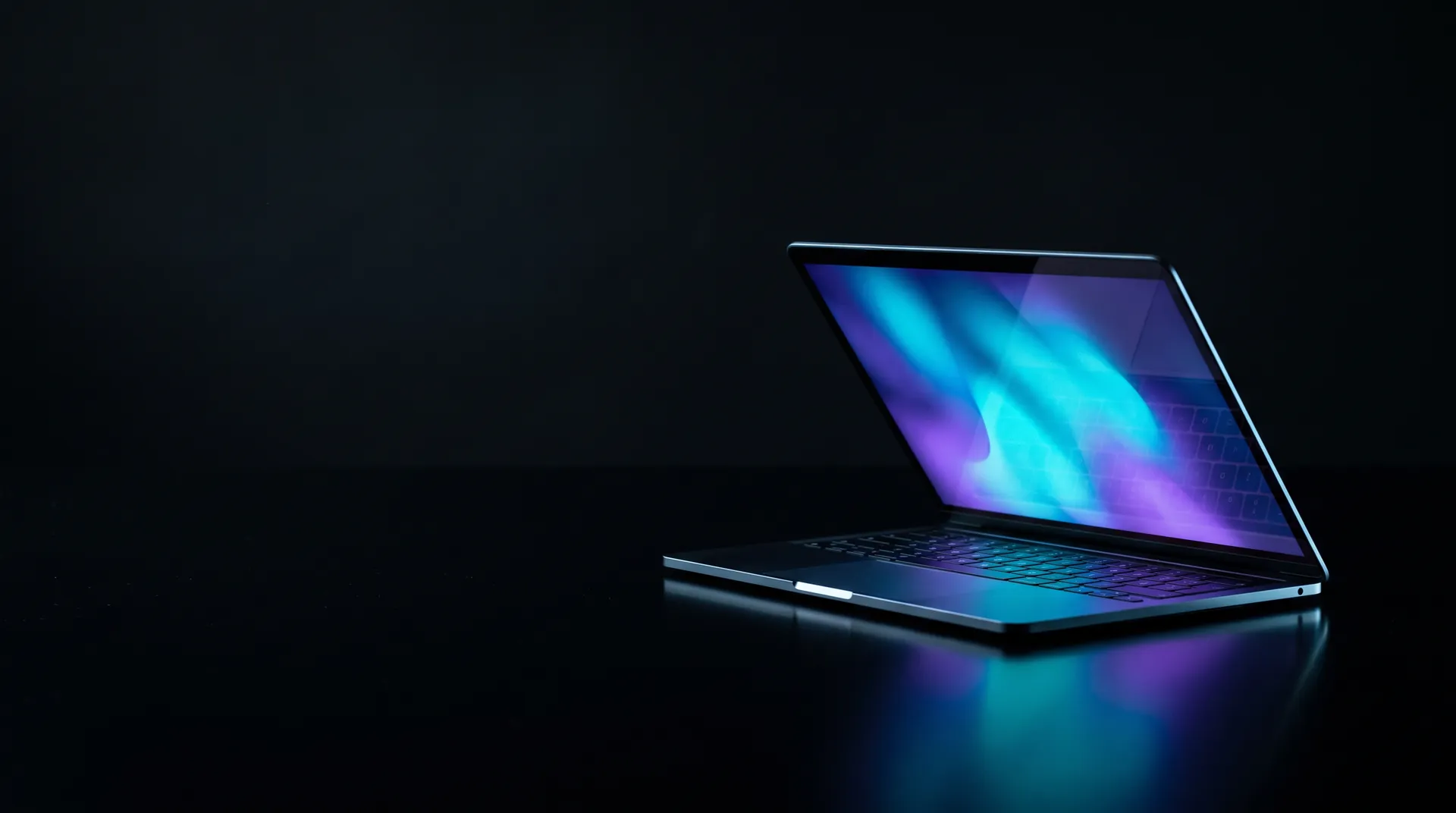 A KERNEL laptop open on a dark desk, its screen glowing cyan and violet